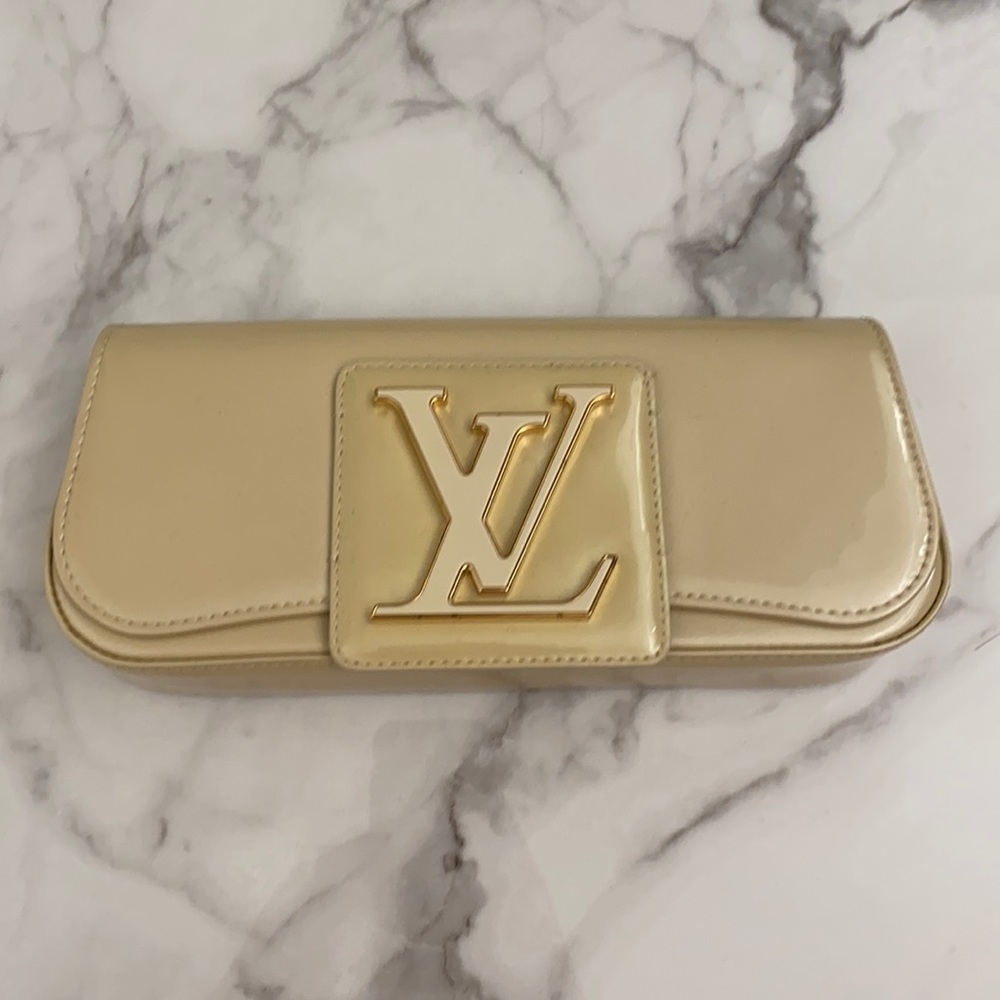 Louis Vuitton cream clutch